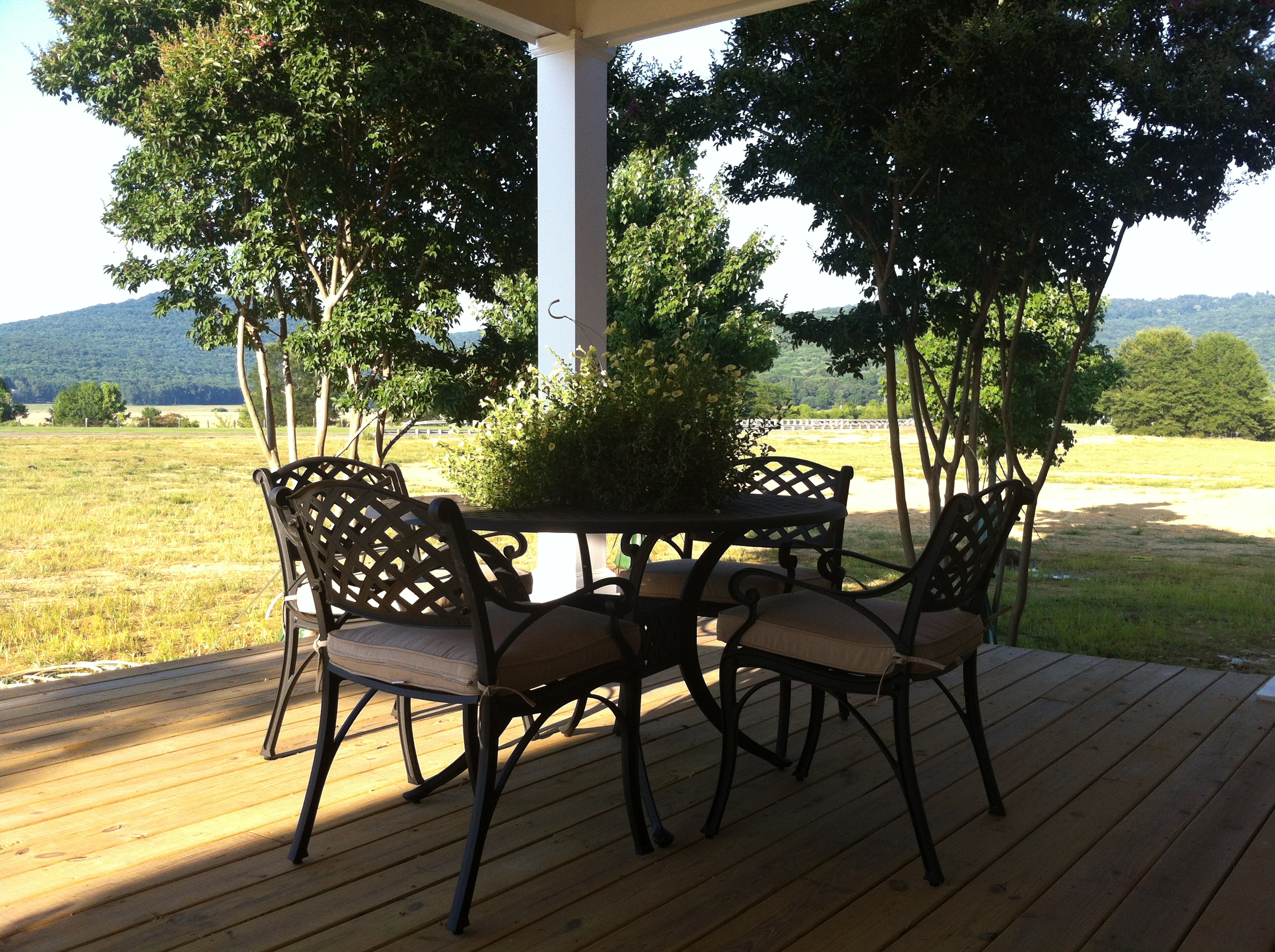 Find some shade, pull up a seat, and chat on our Welcome Center's new Front Porch